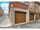 Street-level garage doors on building exterior with brick and stone accents at 226 N Cleveland St # 226E, Indianapolis, IN 46204