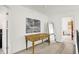 Hallway featuring a wooden desk, a mirror, carpet and a glimpse into other rooms at 226 N Cleveland St # 226E, Indianapolis, IN 46204