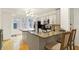 Well-lit kitchen with granite countertops, modern appliances, and a breakfast bar that offers seating for two at 226 N Cleveland St # 226E, Indianapolis, IN 46204
