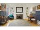 A comfortable living room with a fireplace, built-in shelves, and elegant decor is shown in this interior shot at 226 N Cleveland St # 226E, Indianapolis, IN 46204