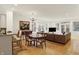 Open-concept living area with hardwood floors, modern lighting, and a spacious layout perfect for entertaining at 226 N Cleveland St # 226E, Indianapolis, IN 46204