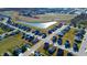 Aerial view of single-Gathering homes in a suburban neighborhood with pond and green space at 2349 Dixon Creek Dr, Whitestown, IN 46075