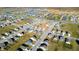 An aerial view of homes in a residential neighborhood with ponds at 2349 Dixon Creek Dr, Whitestown, IN 46075
