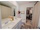 Modern bathroom with double sinks, quartz countertop, walk-in closet, and neutral decor at 2349 Dixon Creek Dr, Whitestown, IN 46075