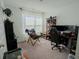 Bedroom with a desk, chair, and open window creating a peaceful work or study space at 2349 Dixon Creek Dr, Whitestown, IN 46075