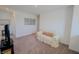Cozy upstairs bonus room with a comfy loveseat and neutral carpet at 2349 Dixon Creek Dr, Whitestown, IN 46075