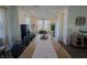 Bright dining room featuring a large table with black chairs and lots of natural light at 2349 Dixon Creek Dr, Whitestown, IN 46075