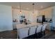 Bright kitchen featuring white cabinets, stainless steel appliances, and an island with barstool seating at 2349 Dixon Creek Dr, Whitestown, IN 46075