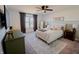 Bright main bedroom featuring a ceiling fan, neutral decor, and a large window for natural light at 2349 Dixon Creek Dr, Whitestown, IN 46075