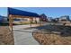 Community pavilion with wood beams and a black metal roof next to a playground and sidewalk at 2349 Dixon Creek Dr, Whitestown, IN 46075