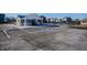 Community pool area featuring a pool house, black metal fence and adjacent parking lot at 2349 Dixon Creek Dr, Whitestown, IN 46075