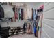 Organized walk-in closet with shelves and hanging rods for optimal storage at 2349 Dixon Creek Dr, Whitestown, IN 46075
