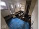 Partially demolished kitchen, ready for remodel with existing cabinets and blue carpet at 2420 N Macedonia Ave, Muncie, IN 47303
