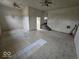 Spacious living room featuring ceiling fans, tile flooring, and a bright, open layout at 2420 N Macedonia Ave, Muncie, IN 47303