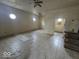 Blank canvas of an open living room with neutral tile flooring, ready for a new vision at 2420 N Macedonia Ave, Muncie, IN 47303