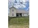 The back exterior has a well-manicured lawn and a covered porch area at 2536 Lanai Ln, Greenwood, IN 46143