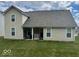 The back of the house features an open patio and backyard lawn at 2536 Lanai Ln, Greenwood, IN 46143