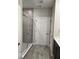 Bathroom featuring glass-enclosed shower, white door and neutral flooring at 2536 Lanai Ln, Greenwood, IN 46143