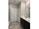 Well-lit bathroom with a double sink vanity and tile flooring at 2536 Lanai Ln, Greenwood, IN 46143