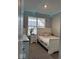 Bedroom featuring a bed, a nightstand, a dresser, light string and a window at 2536 Lanai Ln, Greenwood, IN 46143