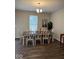 Dining room with a table, chairs, piano and a chandelier at 2536 Lanai Ln, Greenwood, IN 46143