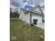 View of the home's garage and side showing lawn and siding at 2536 Lanai Ln, Greenwood, IN 46143