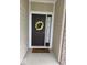 The front door has a wreath with a decorative mat at 2536 Lanai Ln, Greenwood, IN 46143