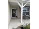 The front porch has a decorated door and seating at 2536 Lanai Ln, Greenwood, IN 46143