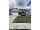 Charming single-story home featuring a well-maintained lawn, two-car garage, and inviting front porch at 2536 Lanai Ln, Greenwood, IN 46143