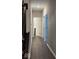 The hallway has luxury vinyl plank flooring with neutral paint at 2536 Lanai Ln, Greenwood, IN 46143