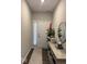 The hallway has luxury vinyl plank flooring with decorative accents at 2536 Lanai Ln, Greenwood, IN 46143