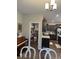 Kitchen and dining area featuring dark cabinets and a pantry at 2536 Lanai Ln, Greenwood, IN 46143