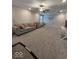 Large carpeted living room with light gray sofa and decor at 2536 Lanai Ln, Greenwood, IN 46143