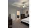 Carpeted main bedroom featuring a ceiling fan and ensuite bathroom at 2536 Lanai Ln, Greenwood, IN 46143
