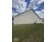 The side exterior has an AC unit and maintained grass at 2536 Lanai Ln, Greenwood, IN 46143