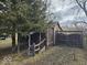 Exterior view of a backyard featuring a shed and privacy fence at 312 N Grafton Ave, Muncie, IN 47303