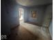 Empty bedroom with bare walls and distressed floors at 312 N Grafton Ave, Muncie, IN 47303