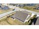 Aerial view of the roof and backyard with neighborhood streets and a pond visible at 3252 Jasper Ln, Brownsburg, IN 46112