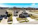 An aerial view of a well-kept home with pristine lawn, driveway, and nearby greenery at 3252 Jasper Ln, Brownsburg, IN 46112