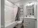 Classic bathroom with a shower-tub combo, toilet, and vanity with a decorative mirror at 3252 Jasper Ln, Brownsburg, IN 46112