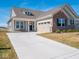 Charming single-story home featuring brick and siding, a two-car garage, and well-maintained landscaping at 3252 Jasper Ln, Brownsburg, IN 46112