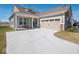 A charming home with a two-car garage and inviting front porch featuring stylish decor at 3252 Jasper Ln, Brownsburg, IN 46112