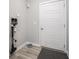 Hallway showing a vacuum cleaner and a door, providing functionality and a convenient storage solution at 3252 Jasper Ln, Brownsburg, IN 46112