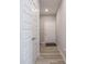 Hallway with tiled flooring and multiple doors leading to other rooms, offering privacy and accessibility at 3252 Jasper Ln, Brownsburg, IN 46112