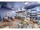 Basement with custom shelving, wet bar, and cozy seating perfect for entertaining and relaxation at 3342 Challenger Dr, Plainfield, IN 46168