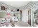 Charming bedroom features floral wallpaper, light green accents, a vanity, and plush decor at 3342 Challenger Dr, Plainfield, IN 46168