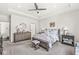 Comfortable bedroom with neutral color scheme, decorative ceiling fan, bedside tables and dressers at 3342 Challenger Dr, Plainfield, IN 46168