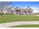 Gorgeous single-story home featuring a stone and brick facade, a manicured lawn, and a lovely front walkway at 3342 Challenger Dr, Plainfield, IN 46168