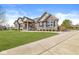 Charming single-story home with stone and brick facade, manicured lawn, and a welcoming front porch at 3342 Challenger Dr, Plainfield, IN 46168