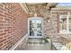 Charming front entry with double doors, decorative stone, and a cozy bench at 3342 Challenger Dr, Plainfield, IN 46168
